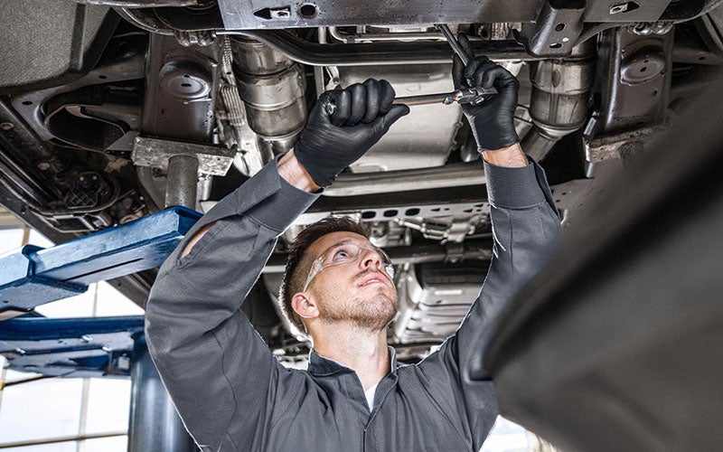 Service employee working on car